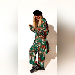 NWT (Still in bag & sold out online) dressed in lala stain playsuit (L/XL)